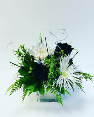 Elegant New Year's floral arrangement with silver-toned blooms of paradise
