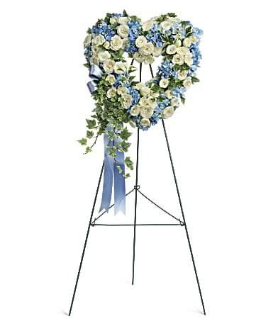 Pure Heart funeral arrangement with Blooms of Paradise flowers